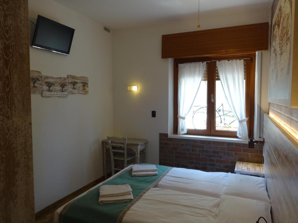 Postel nebo postele na pokoji v ubytování B&B Casa Gabriele