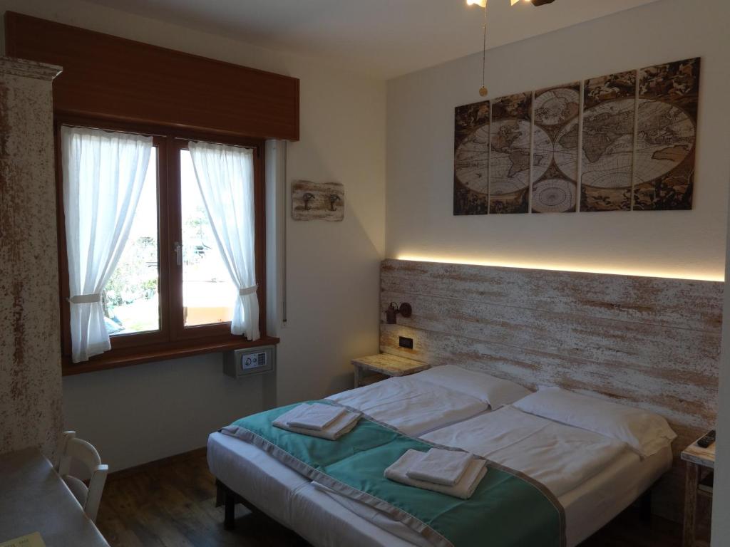 Postel nebo postele na pokoji v ubytování B&B Casa Gabriele