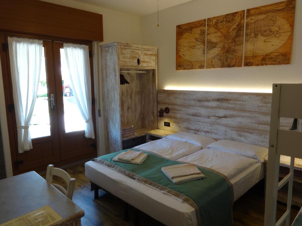 Postel nebo postele na pokoji v ubytování B&B Casa Gabriele