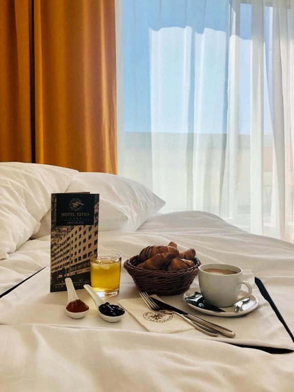 Postel nebo postele na pokoji v ubytování Hotel Tatra
