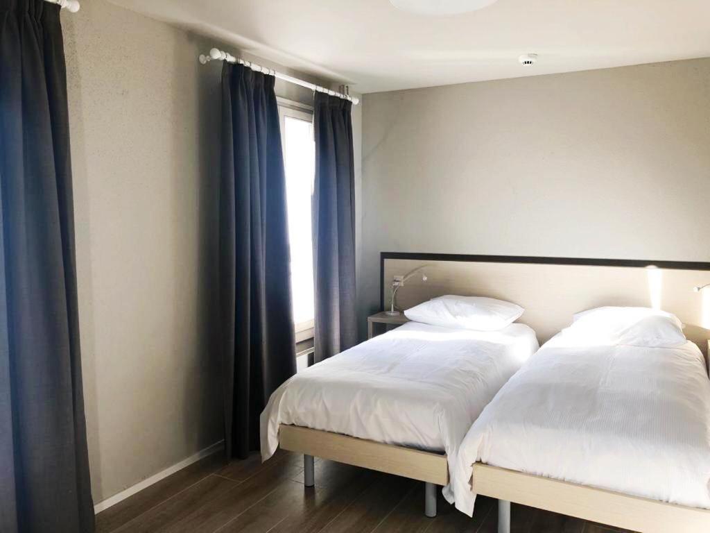 Postel nebo postele na pokoji v ubytování Hotel pas de Cheville