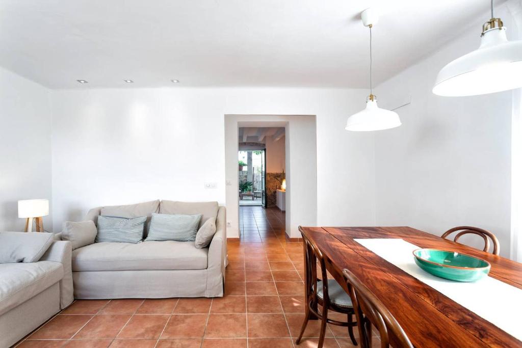 a living room with a couch and a table at Can Terrats in Blanes