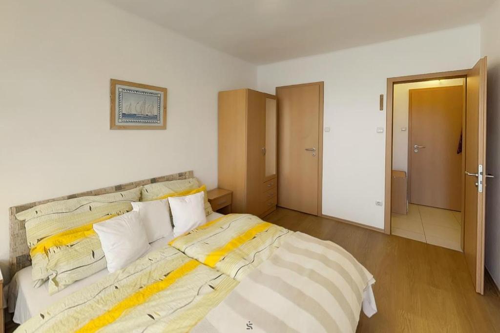 Posteľ alebo postele v izbe v ubytovaní Hajnalház Apartments