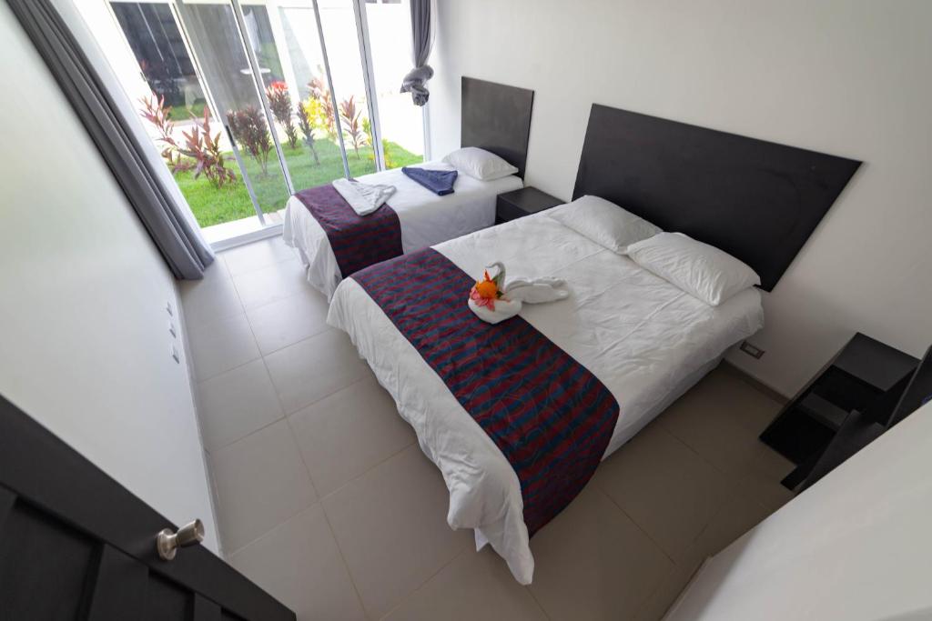 Postel nebo postele na pokoji v ubytování Uvita Paradise