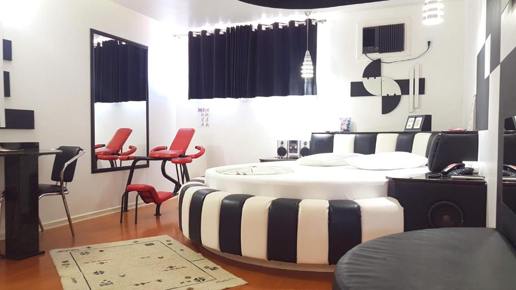 Postel nebo postele na pokoji v ubytování L'acqua Motel Express