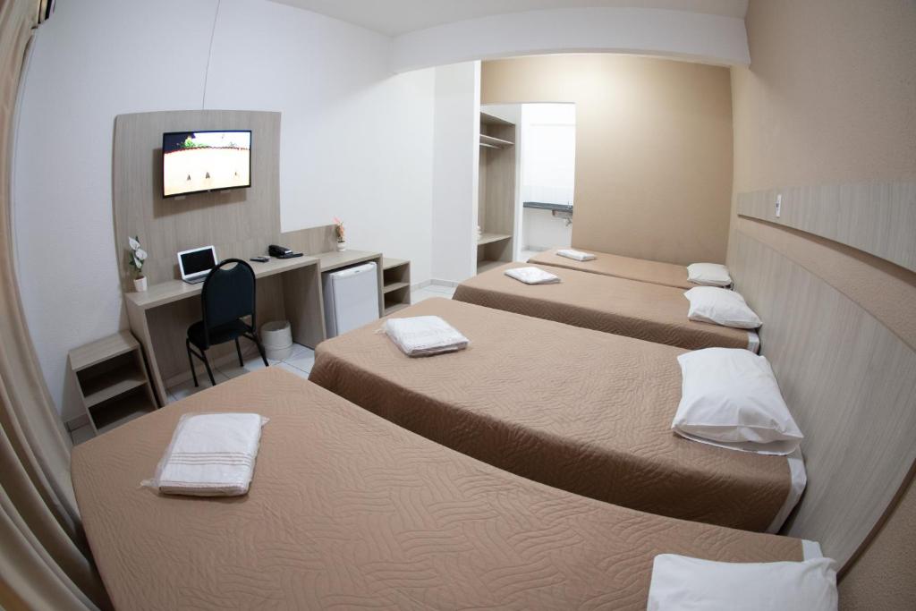 Postel nebo postele na pokoji v ubytování Getúllio Hotel