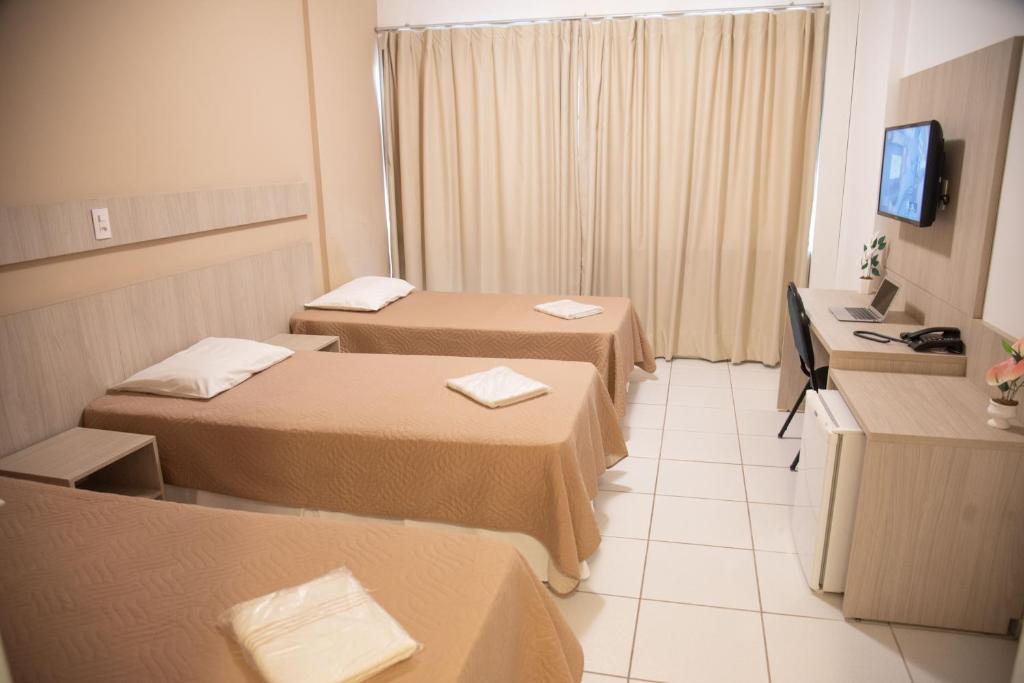 TV a/nebo společenská místnost v ubytování Getúllio Hotel