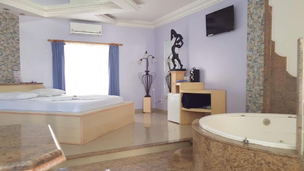 Postel nebo postele na pokoji v ubytování L'acqua Motel Express
