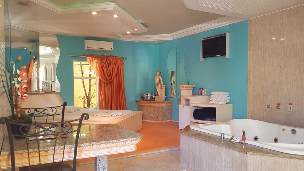 TV a/nebo společenská místnost v ubytování L'acqua Motel Express