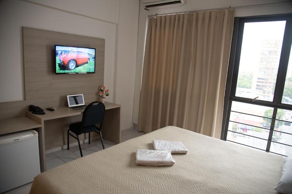 TV a/nebo společenská místnost v ubytování Getúllio Hotel