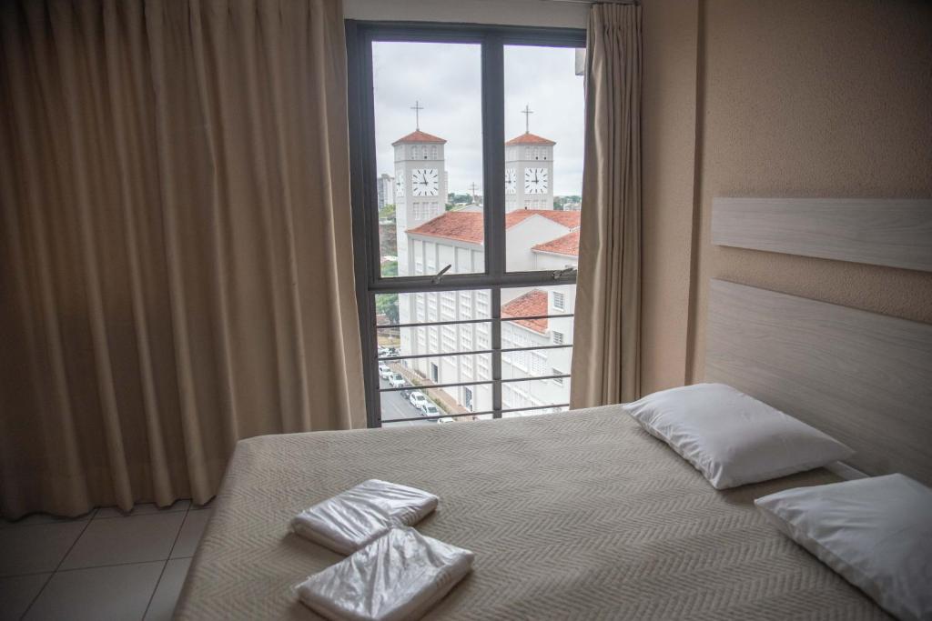 Postel nebo postele na pokoji v ubytování Getúllio Hotel