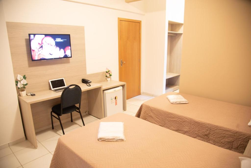 TV a/nebo společenská místnost v ubytování Getúllio Hotel