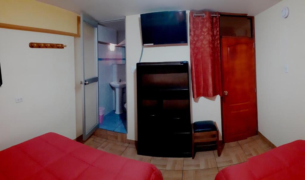Postel nebo postele na pokoji v ubytování Hostal kuntur cusco