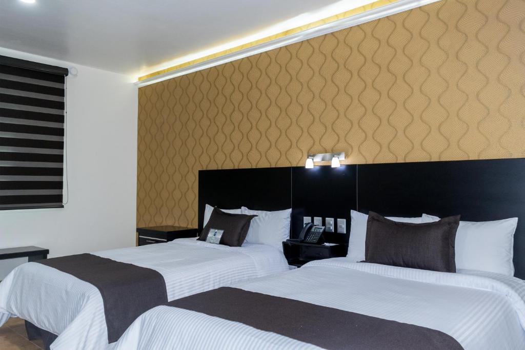 Postel nebo postele na pokoji v ubytování Hotel 5 Inn Plus
