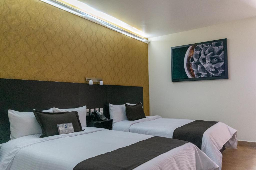 Postel nebo postele na pokoji v ubytování Hotel 5 Inn Plus