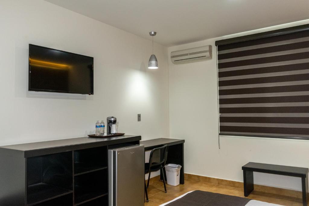 TV a/nebo společenská místnost v ubytování Hotel 5 Inn Plus