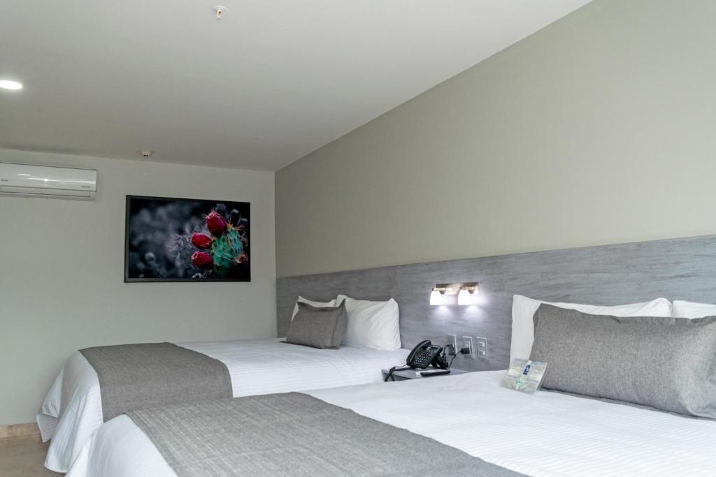Postel nebo postele na pokoji v ubytování Hotel 5 Inn Plus
