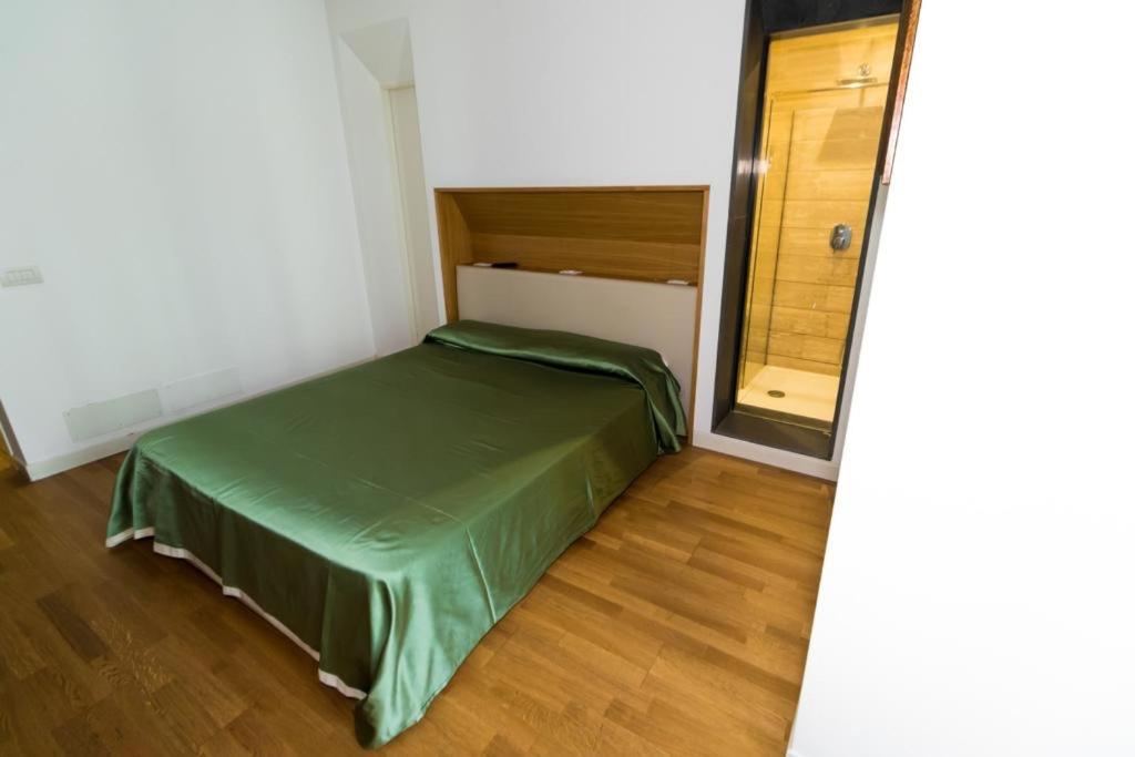 A bed or beds in a room at Nerello Suites and Rooms
