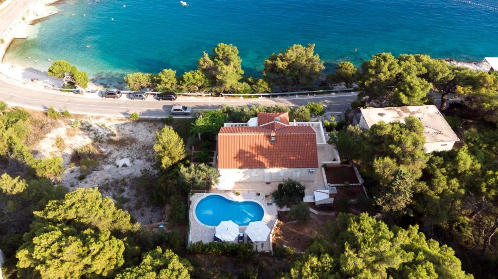 an aerial view of a house with a swimming pool at Villa Katja in Sumartin