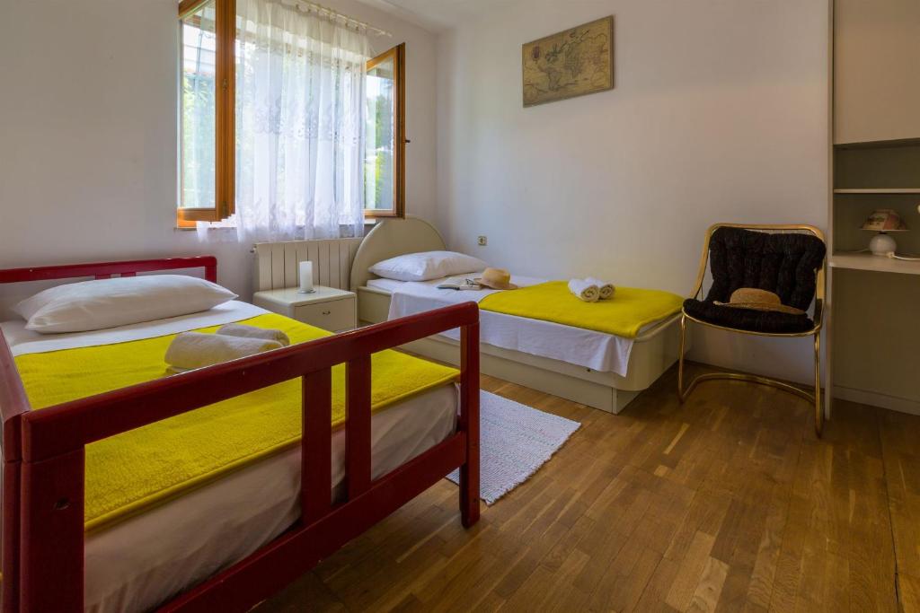 Posteľ alebo postele v izbe v ubytovaní Apartments Dorijan i Karlo