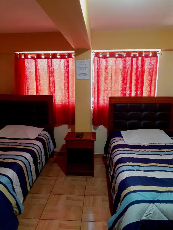 Postel nebo postele na pokoji v ubytování Hostal kuntur cusco