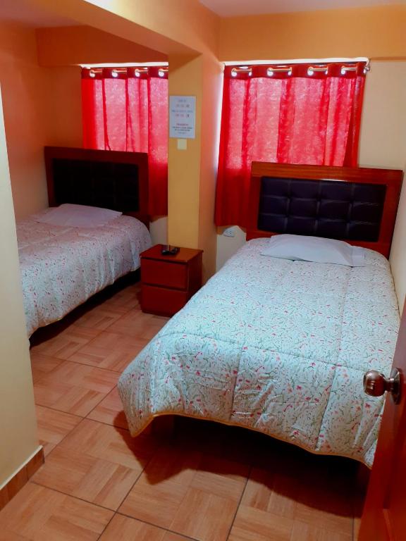 Postel nebo postele na pokoji v ubytování Hostal kuntur cusco