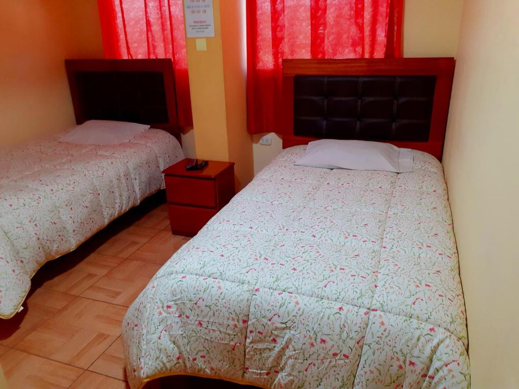 Postel nebo postele na pokoji v ubytování Hostal kuntur cusco