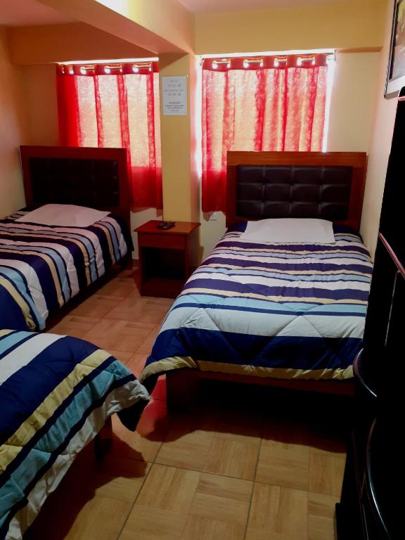 Postel nebo postele na pokoji v ubytování Hostal kuntur cusco