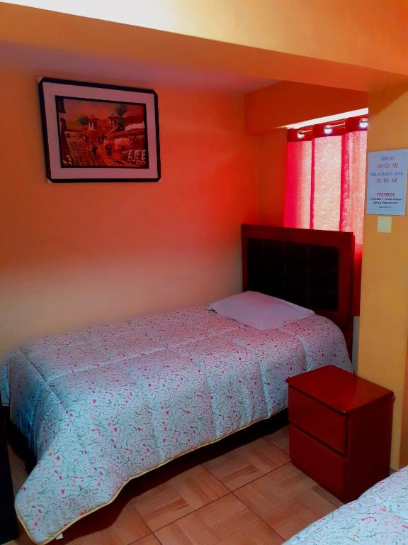 Postel nebo postele na pokoji v ubytování Hostal kuntur cusco