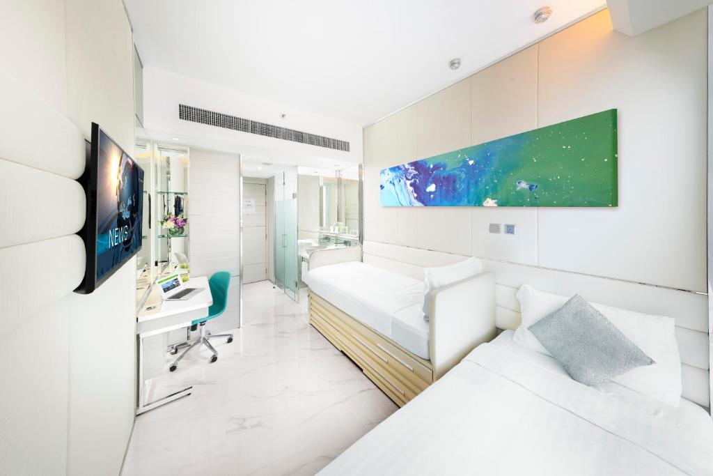 Postel nebo postele na pokoji v ubytování iclub Mong Kok Hotel