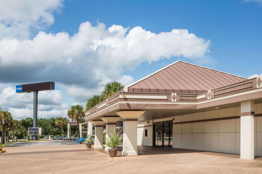 a gas station with at Travelodge by Wyndham Deltona in Deltona