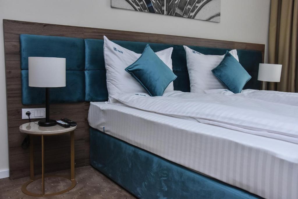 Postel nebo postele na pokoji v ubytování Hotel Nais