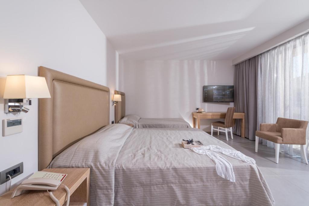 Postel nebo postele na pokoji v ubytování Cactus Beach Hotel