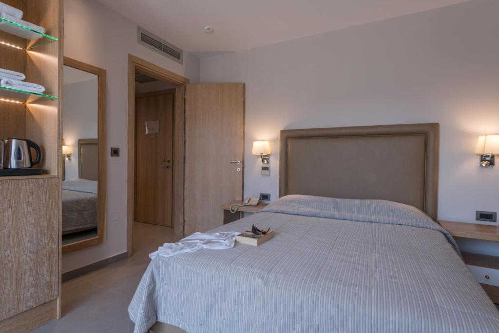 Postel nebo postele na pokoji v ubytování Cactus Beach Hotel