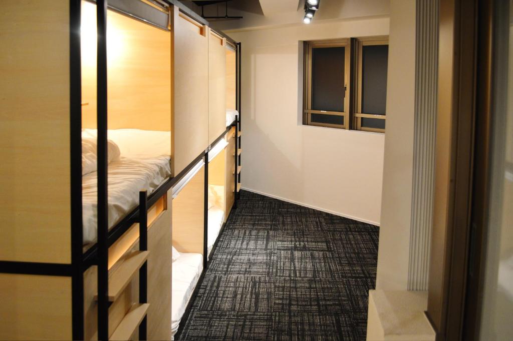 Postel nebo postele na pokoji v ubytování Guest House Tokyo Azabu