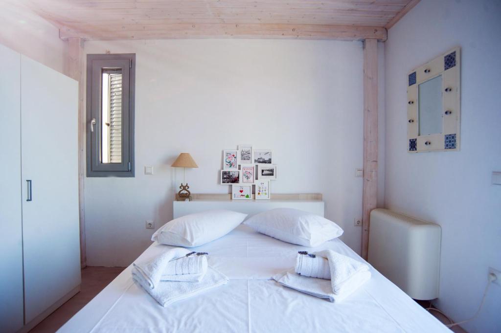 Łóżko lub łóżka w pokoju w obiekcie LAURA_SEA VIEW_HOUSE