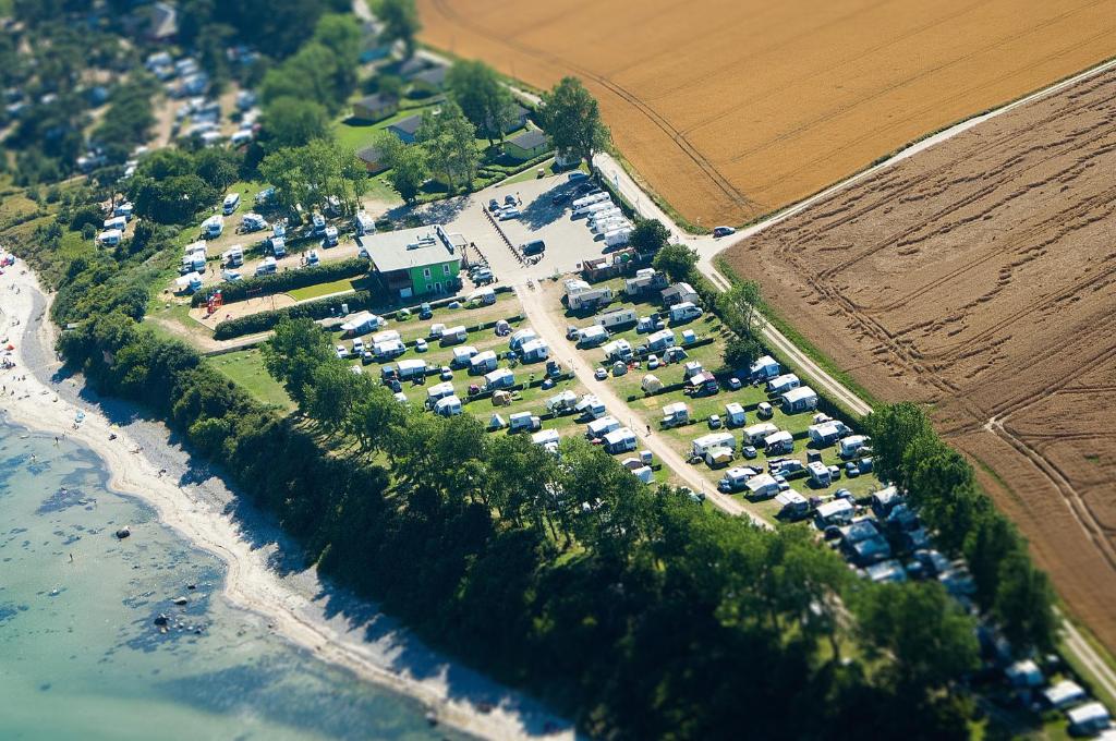 an aerial view of a parking lot next to the ocean at Knaus Camping- und Ferienhauspark Rügen in Altenkirchen