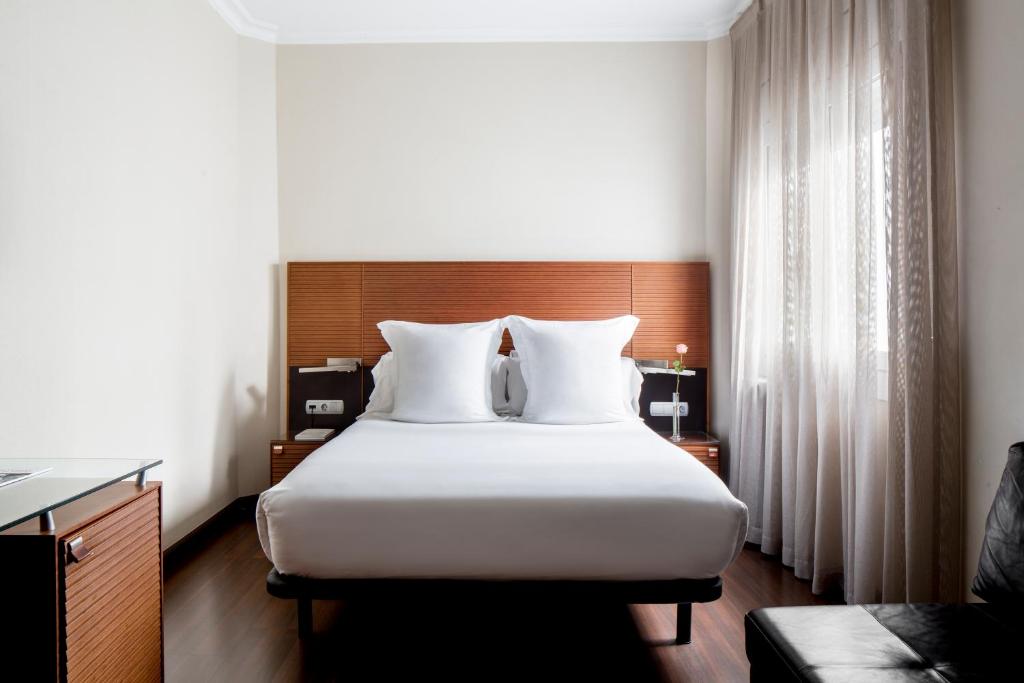 Postel nebo postele na pokoji v ubytování Hotel Astoria