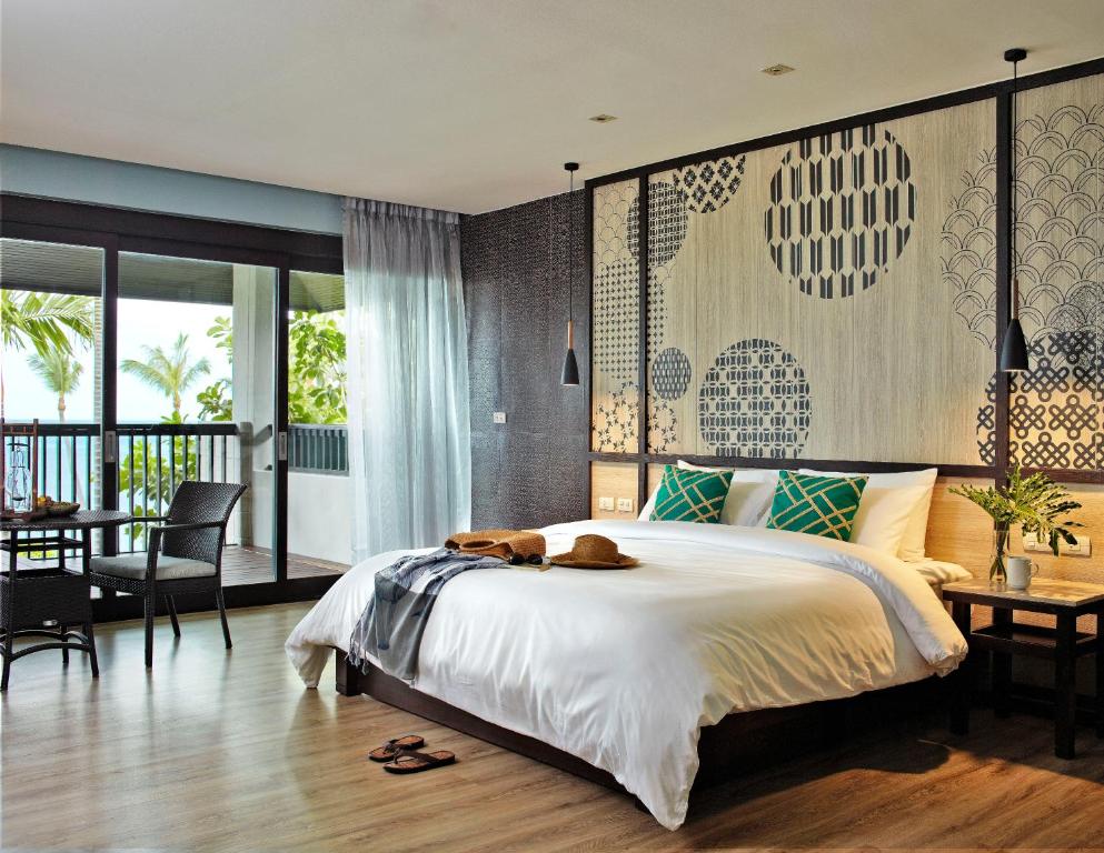 Postel nebo postele na pokoji v ubytování Sareeraya Villas & Suites