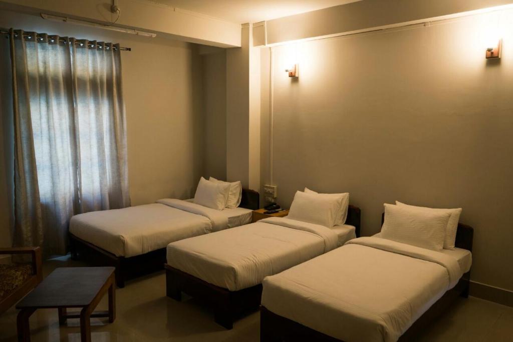 Postel nebo postele na pokoji v ubytování Hotel Ariel