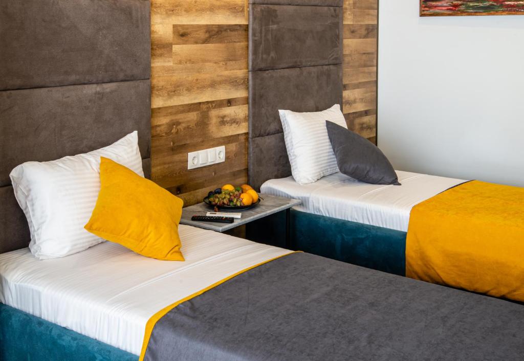 Postel nebo postele na pokoji v ubytování BG Palace Hotel