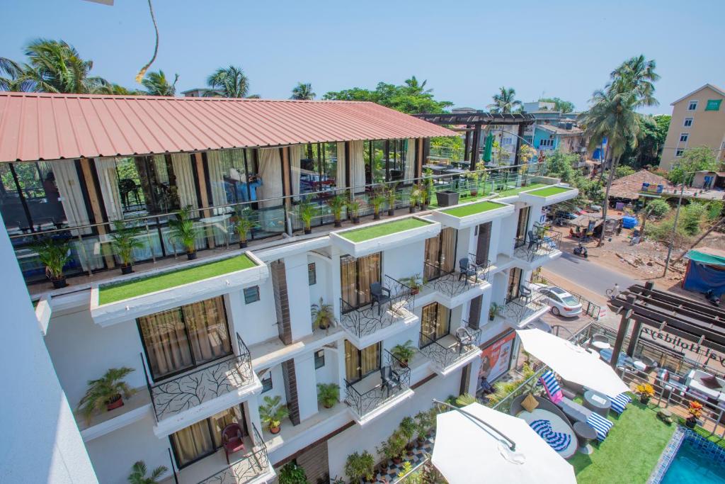 an overhead view of a building with a pool at Nitya Resort, Calangute in Calangute
