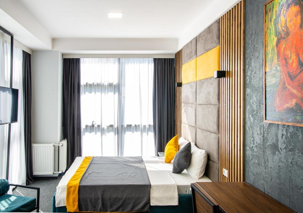Postel nebo postele na pokoji v ubytování BG Palace Hotel