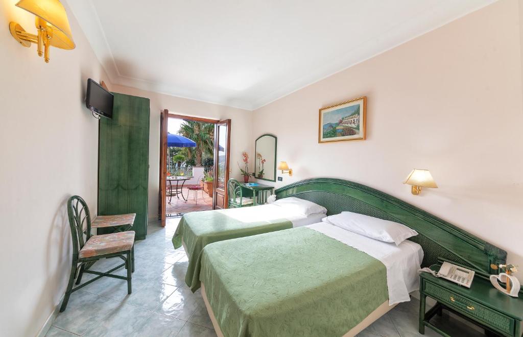Postel nebo postele na pokoji v ubytování Hotel Belvedere