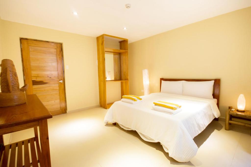 Postel nebo postele na pokoji v ubytování Boracay Amor Apartment