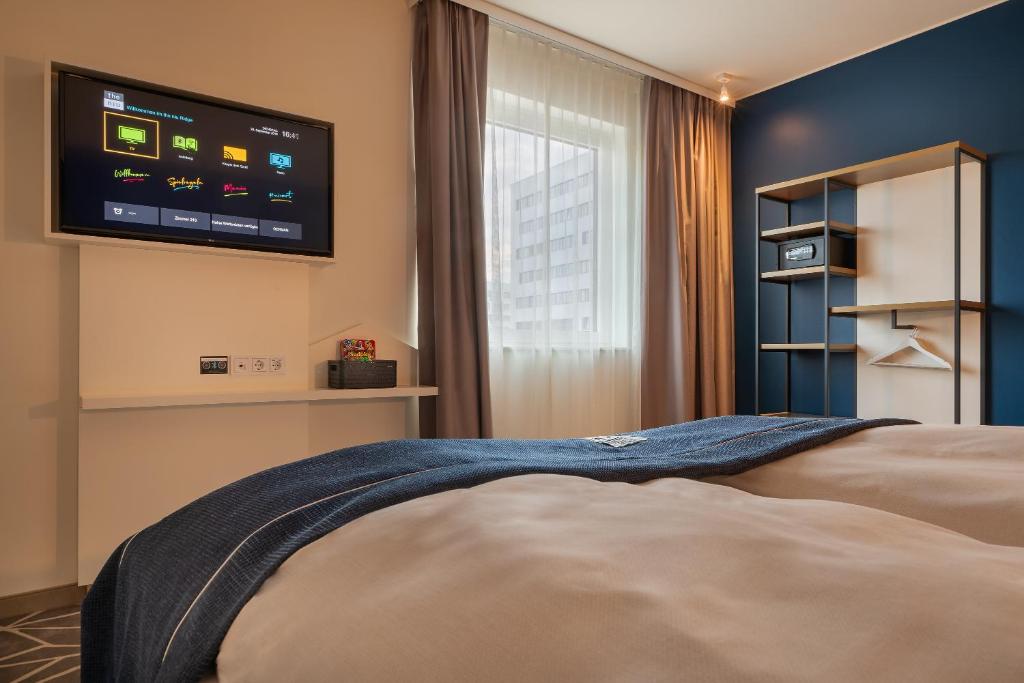 Postel nebo postele na pokoji v ubytování Holiday Inn - the niu, Ridge Halle Central Station by IHG