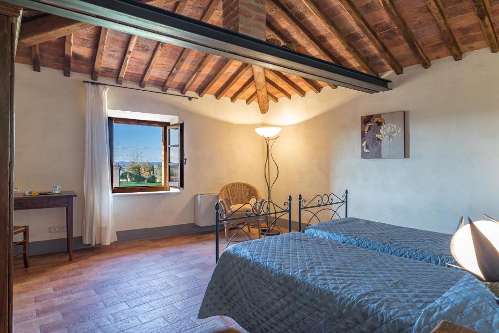 Postel nebo postele na pokoji v ubytování Agriturismo Baccoleno