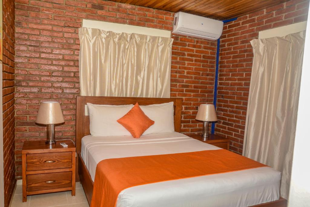 Postel nebo postele na pokoji v ubytování Hotel Jaraba