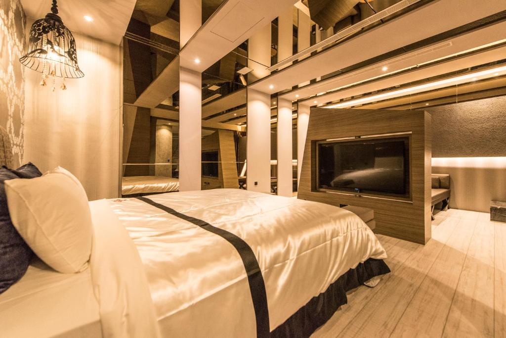Postel nebo postele na pokoji v ubytování Voga Motel
