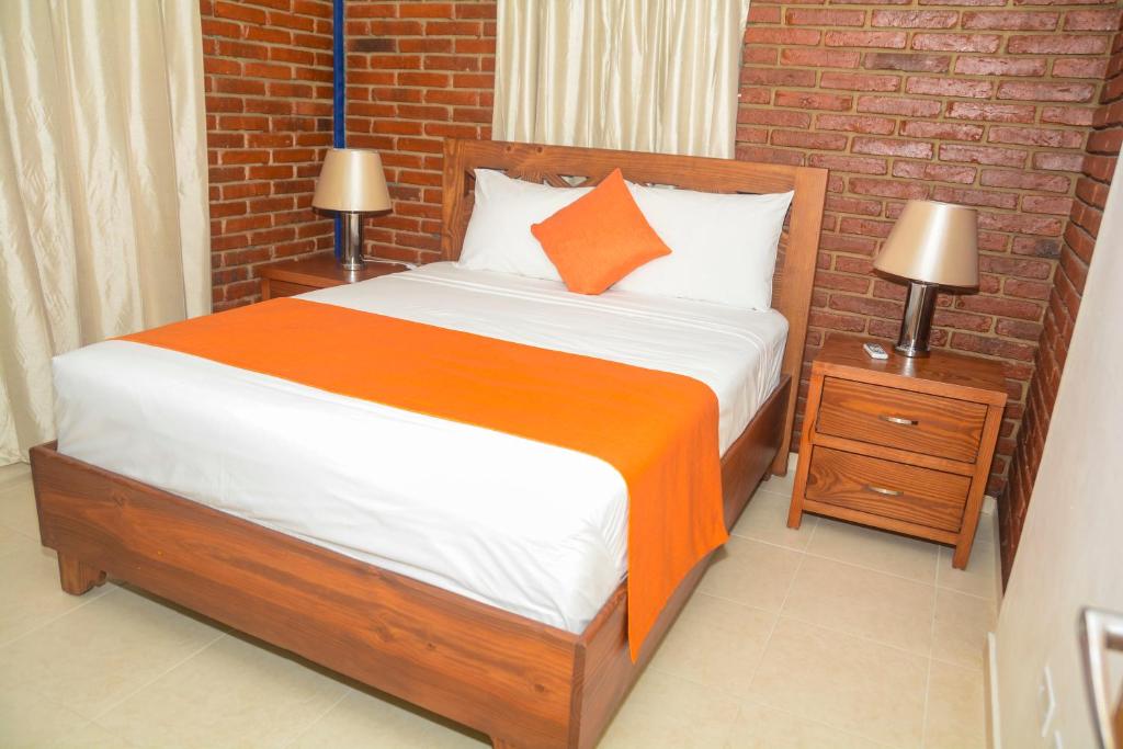 Postel nebo postele na pokoji v ubytování Hotel Jaraba